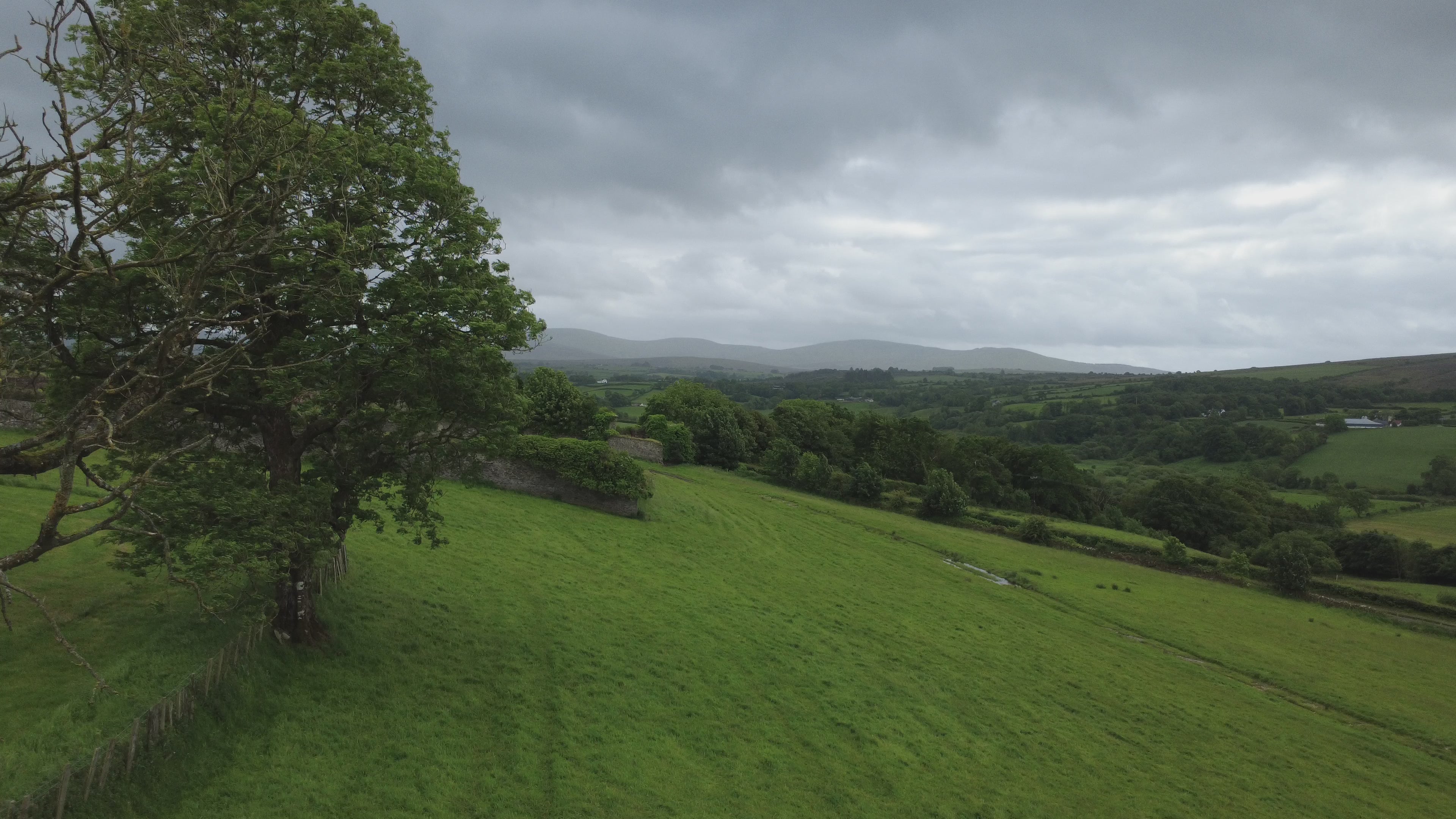 Altinaghree Castle — County Tyrone Countryside 360 Aerial Pan, Windmills and Rolling Landscape | 4K Cinematic Stock Footage